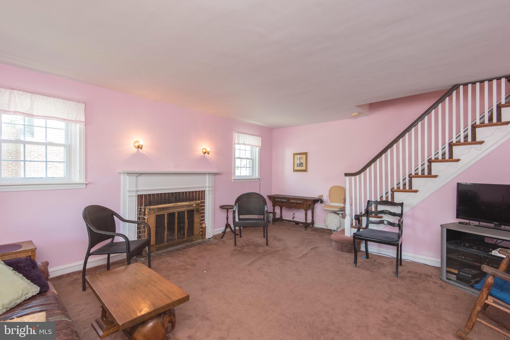9 Fairfield Road Havertown, PA 19083 - Photo 10 of 31 a living room with furniture a fireplace and a flat screen tv