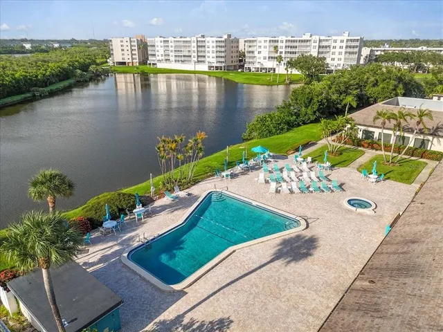 an aerial view of a house with a lake view