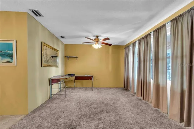 a view of a livingroom with wooden floor and furniture