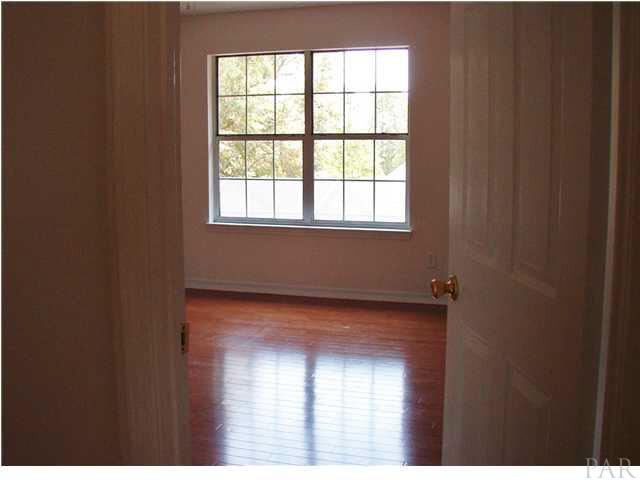 1436 Kings Road Cantonment, FL 32533 - Photo 21 of 21 Bedroom with hard wood floors