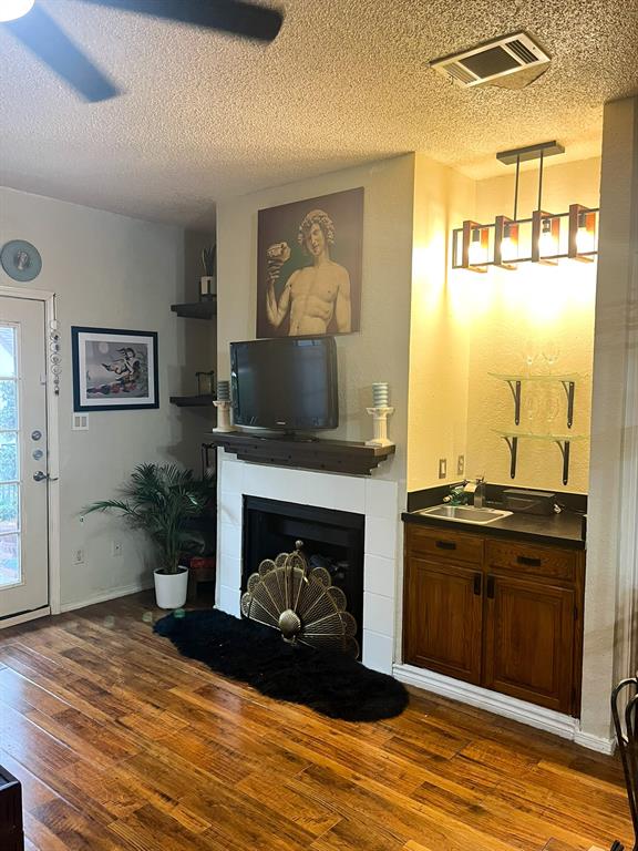 13217 Emily Road, Unit 3103 Dallas, TX 75240 - Photo 11 of 24 a living room with furniture and a fireplace