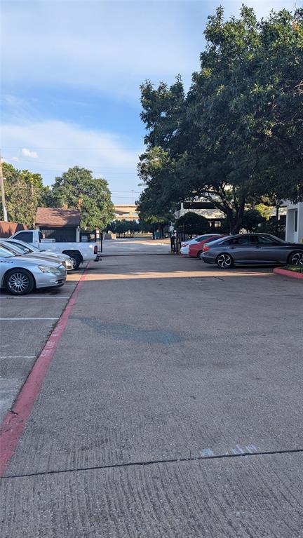 13217 Emily Road, Unit 3103 Dallas, TX 75240 - Photo 14 of 15 a view of street with parked cars