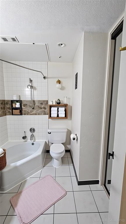 13217 Emily Road, Unit 3103 Dallas, TX 75240 - Photo 17 of 24 a bathroom with a sink a toilet and shower