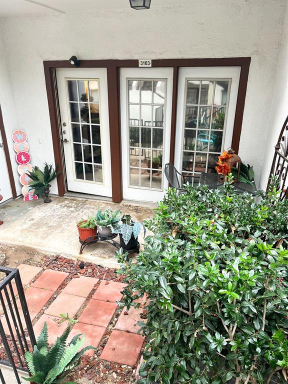 13217 Emily Road, Unit 3103 Dallas, TX 75240 - Photo 2 of 24 front view of a house with a rug