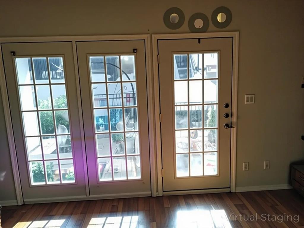 13217 Emily Road, Unit 3103 Dallas, TX 75240 - Photo 7 of 24 an empty room with wooden floor and windows
