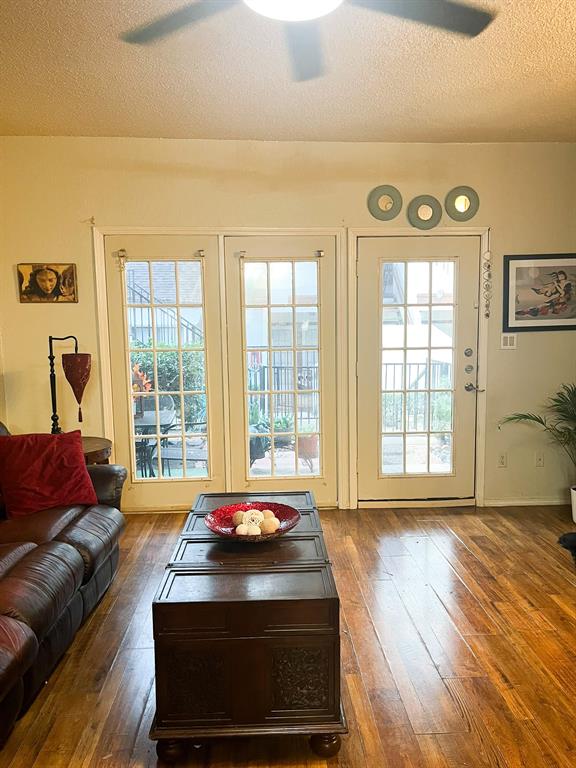 13217 Emily Road, Unit 3103 Dallas, TX 75240 - Photo 10 of 24 a living room with furniture and a floor to ceiling window