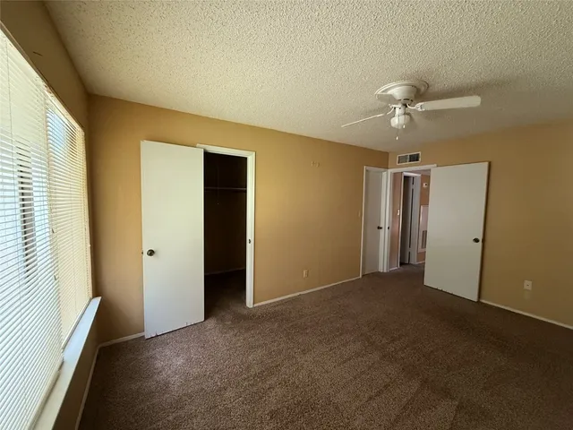 a view of empty room with fan