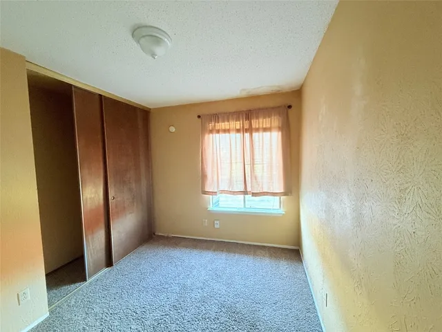 a view of a room with wooden wall