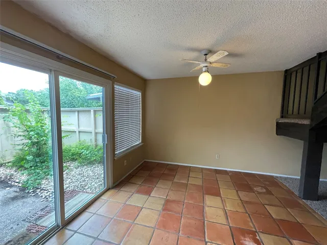 a view of an empty room with windows
