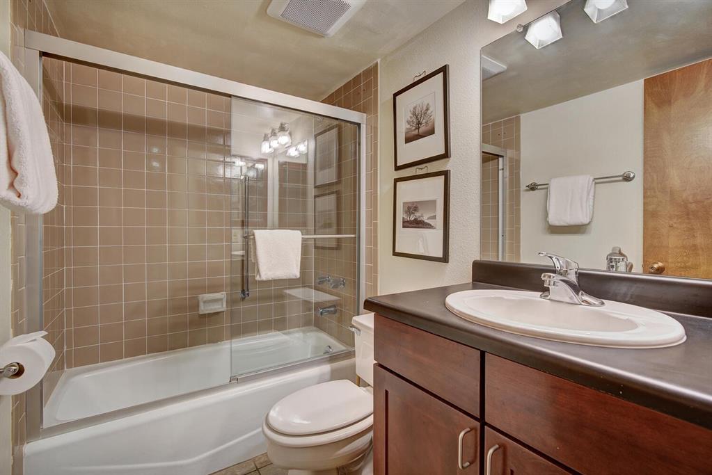 800 Copper Road, Unit 104 Copper Mountain, CO 80443 - Photo 13 of 32 a bathroom with a sink a toilet and shower