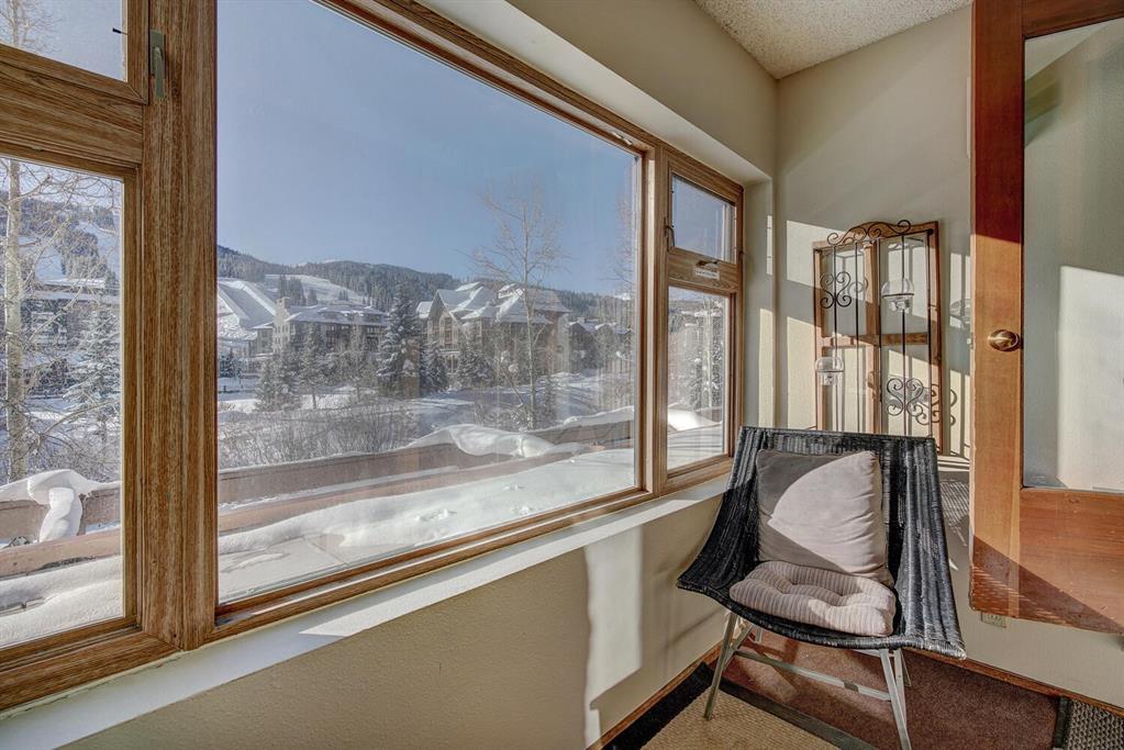800 Copper Road, Unit 104 Copper Mountain, CO 80443 - Photo 2 of 32 a bathroom with a granite countertop window and a bathtub
