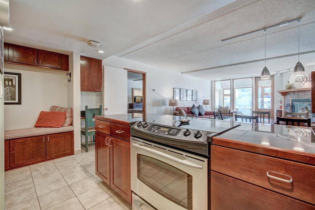 800 Copper Road, Unit 104 Copper Mountain, CO 80443 - Photo 10 of 32 a kitchen with stainless steel appliances granite countertop a stove and a sink