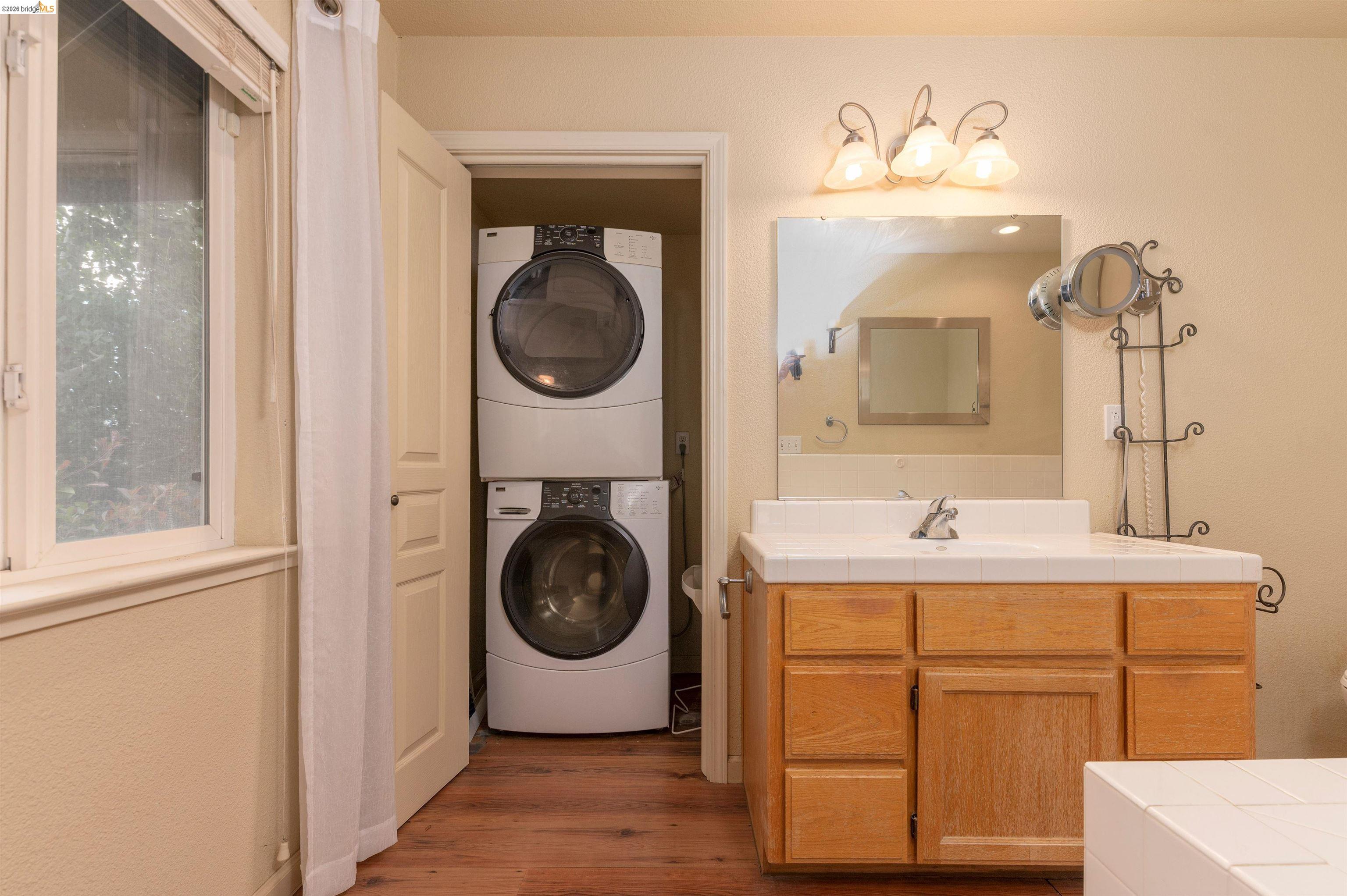 22401 Ridge Road Twain Harte, CA 95383 - Photo 16 of 56 Integrated laundry area featuring stacked front-load washer and dryer