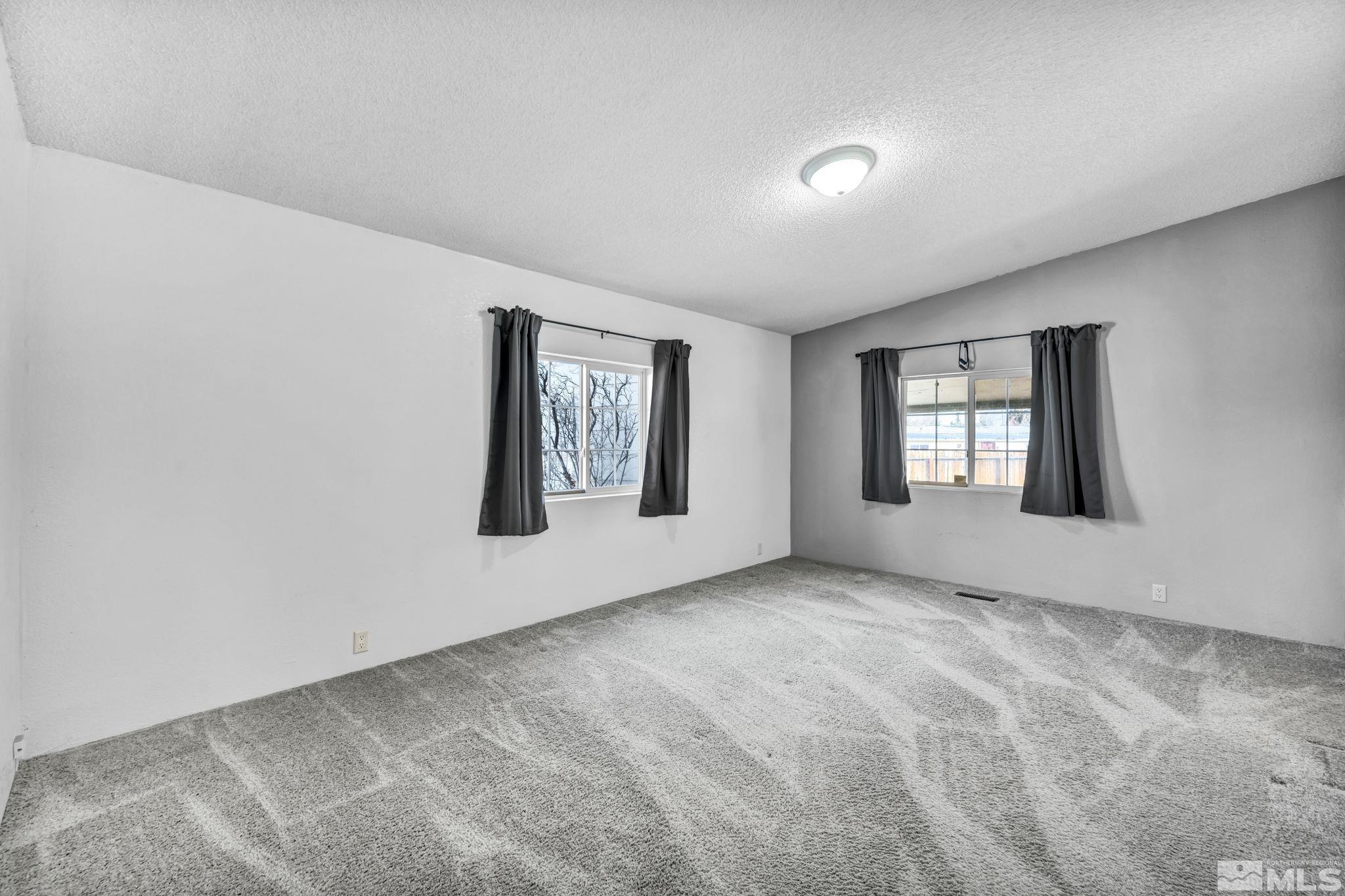 16245 Autunite Circle Reno, NV 89521 - Photo 19 of 37 a view of an empty room with window