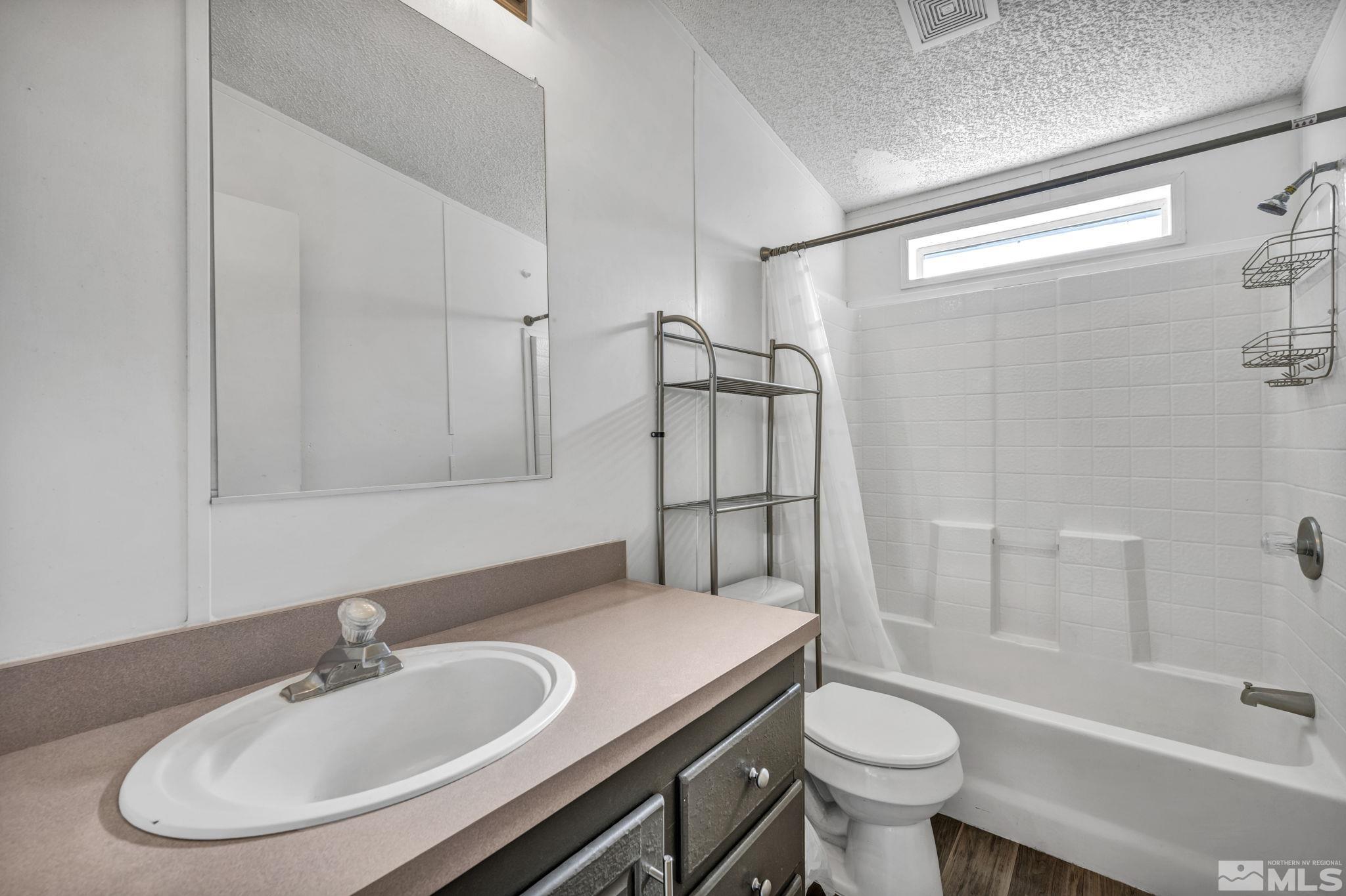 16245 Autunite Circle Reno, NV 89521 - Photo 33 of 37 a bathroom with a sink toilet and a bathtub