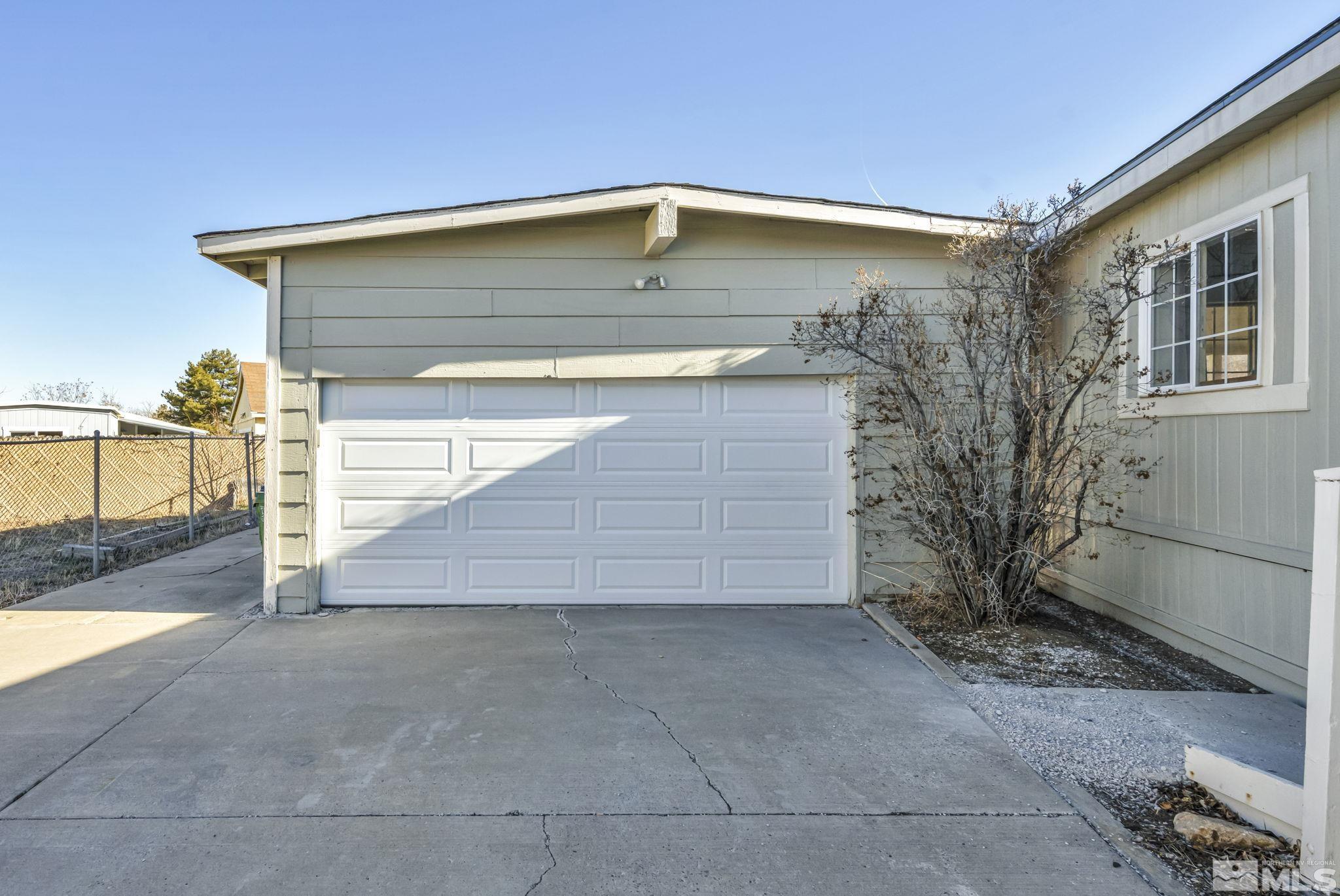 16245 Autunite Circle Reno, NV 89521 - Photo 6 of 37 a front view of a house with garage