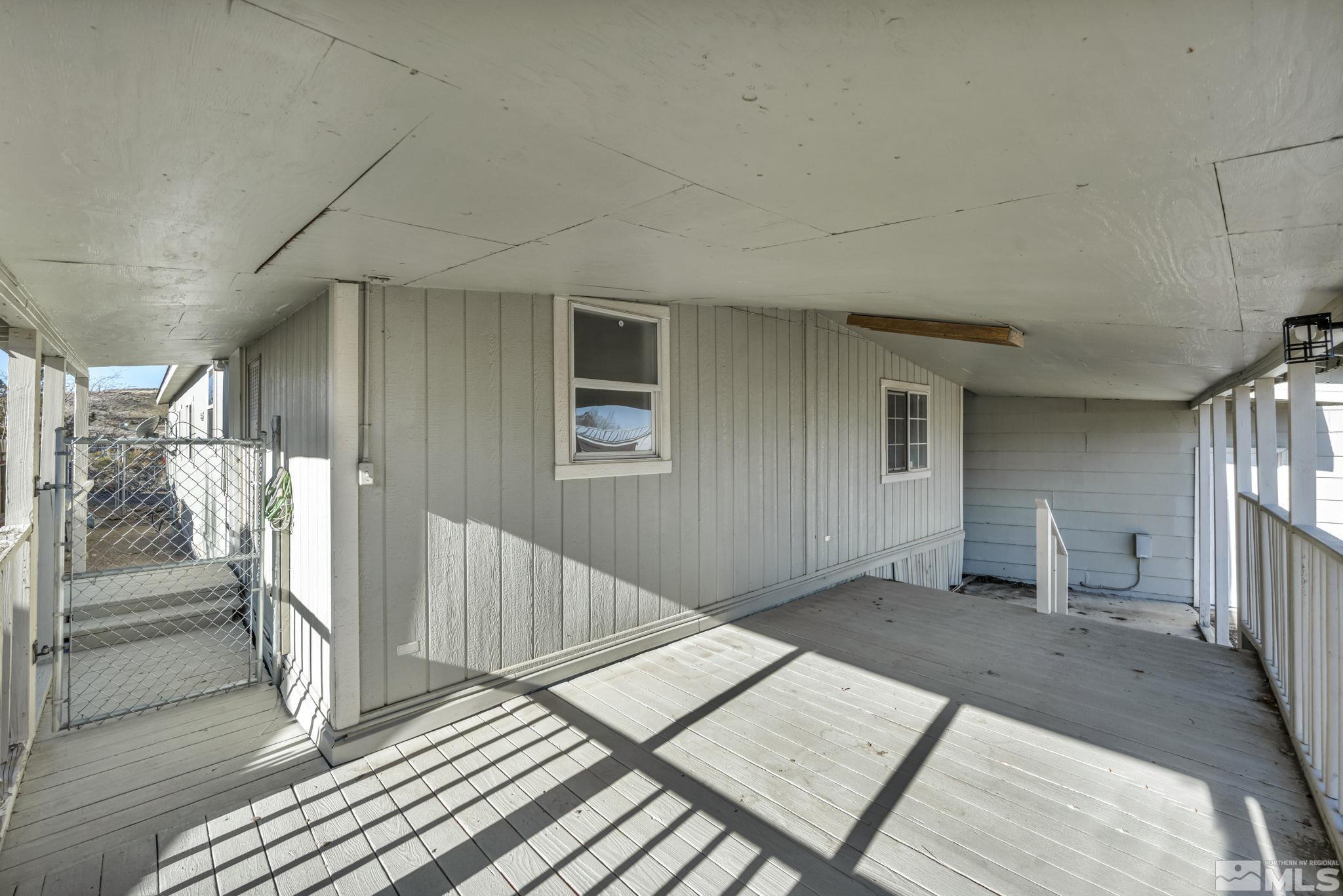 16245 Autunite Circle Reno, NV 89521 - Photo 10 of 37 a view of a hallway with wooden floor and stairs
