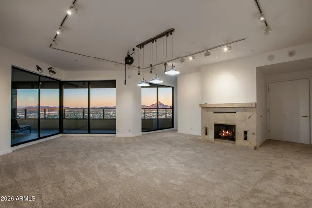 a view of an empty room with windows