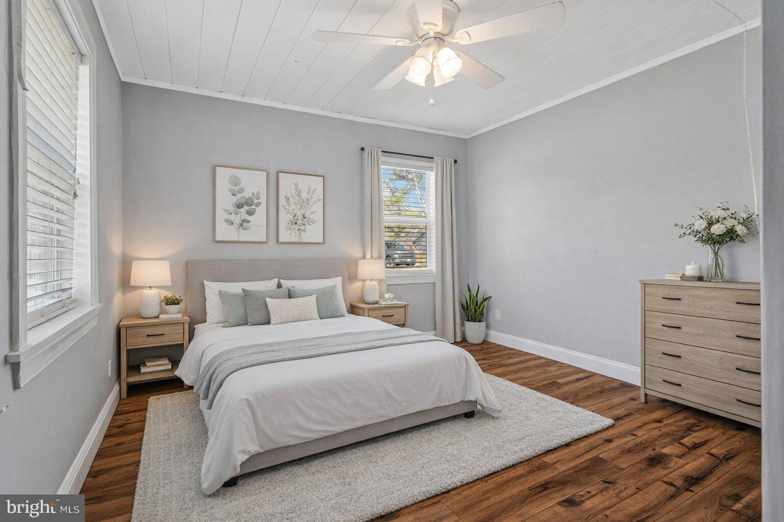 4103 Port Tobacco Road Nanjemoy, MD 20662 - Photo 7 of 19 a bedroom with a bed and a chandelier