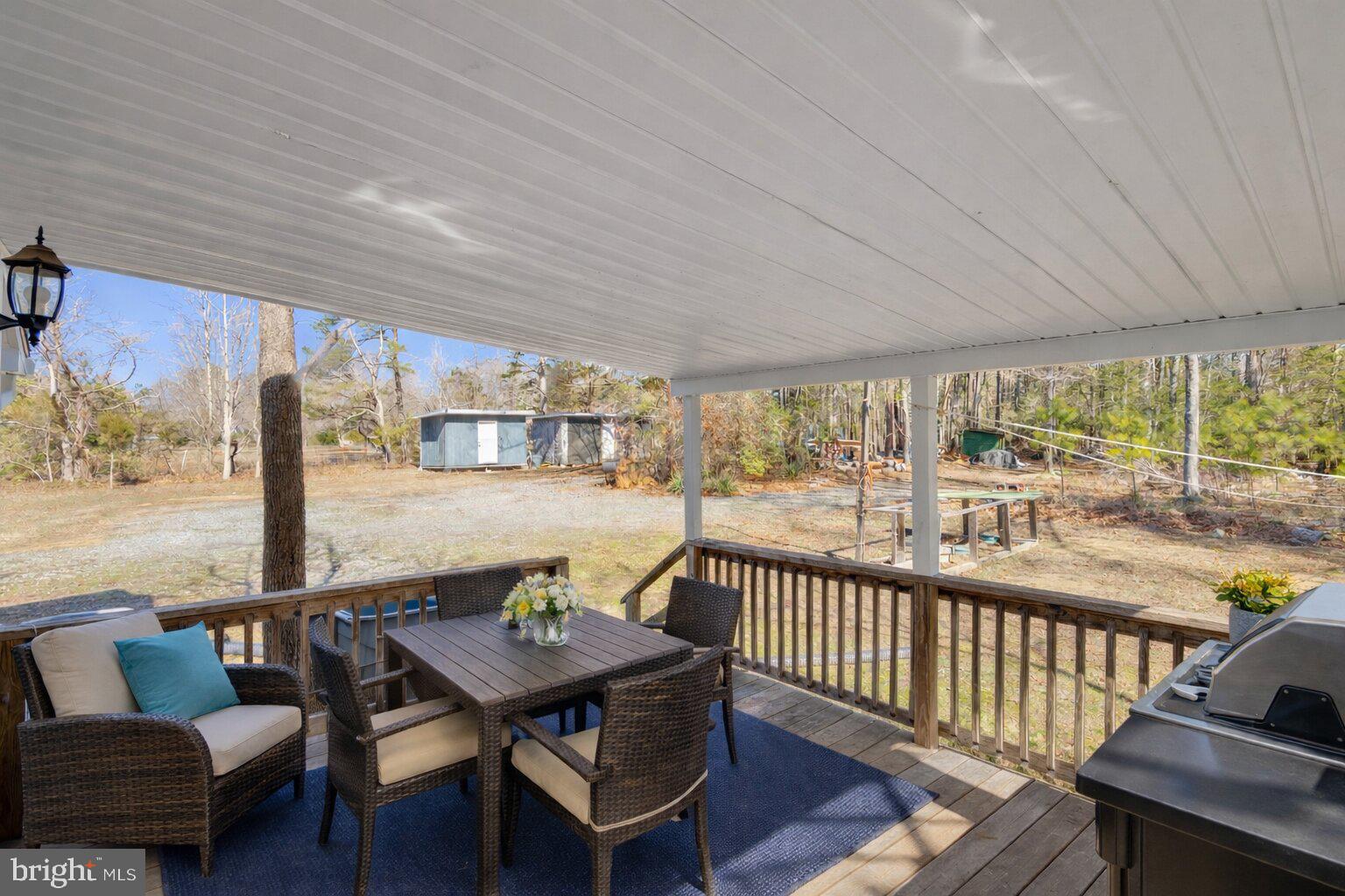 4103 Port Tobacco Road Nanjemoy, MD 20662 - Photo 10 of 19 a view of a chairs and table in patio