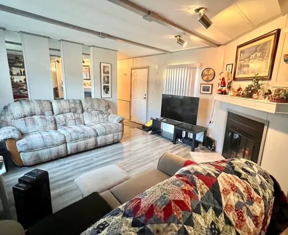 a bedroom with furniture and a fireplace