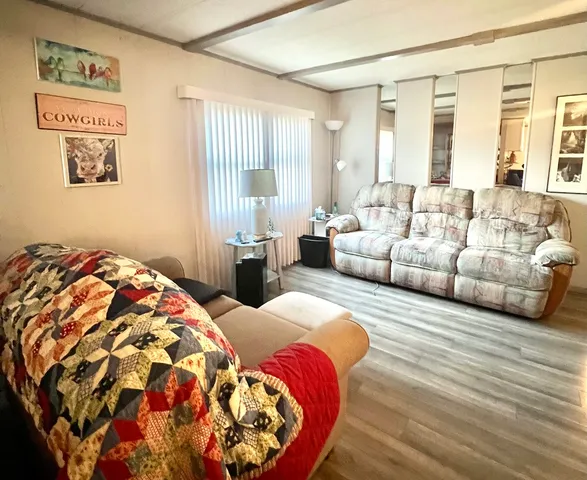 a bedroom with a bed and a couch