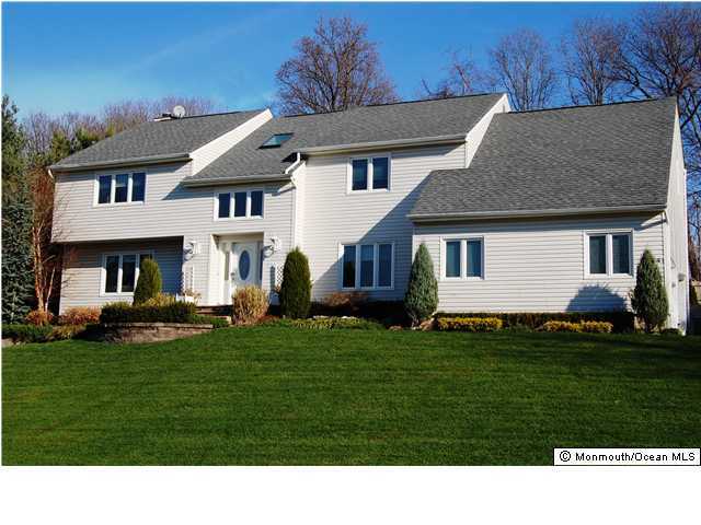 227 Nottingham Road Morganville, NJ 07751 - Photo 1 of 3 a black and white house with a yard