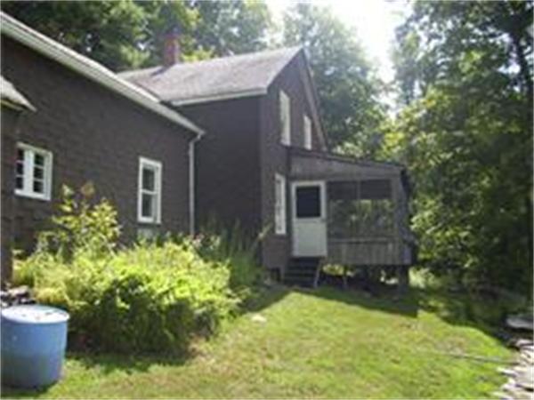 36 Smith Road Chester, MA 01050 - Photo 3 of 16 a view of a house with backyard sitting area and garden