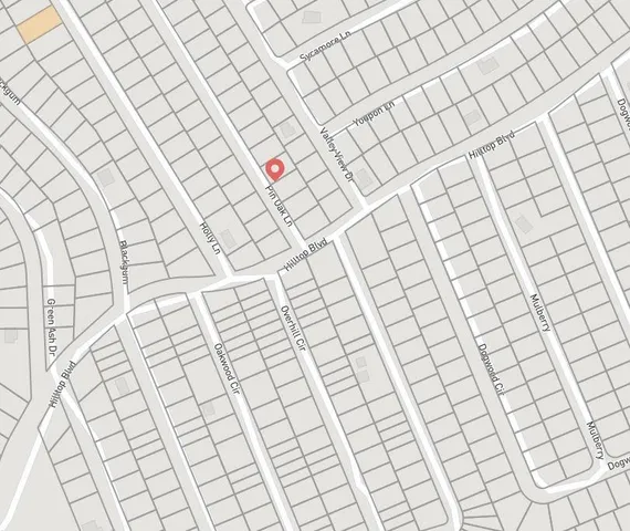 an aerial view of a house with outdoor space