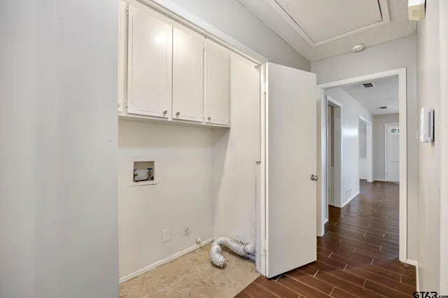 a view of an entryway with wooden floor