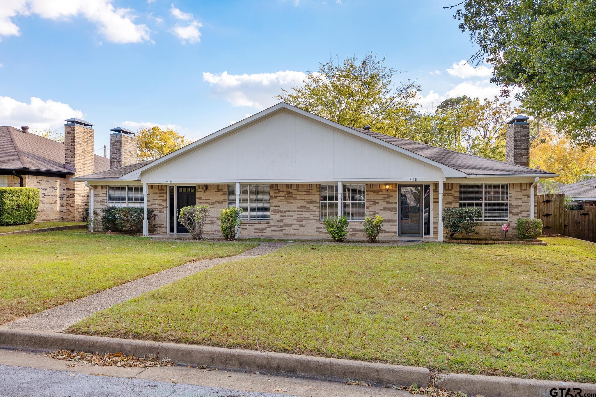 418 Boyd Lane Tyler, TX 75703 - Photo 2 of 25 a front view of a house with a garden