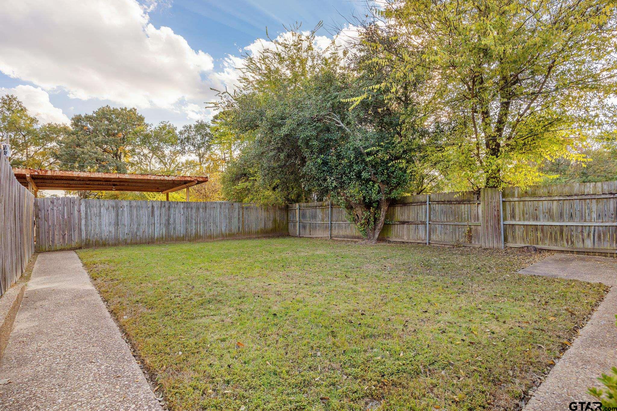 418 Boyd Lane Tyler, TX 75703 - Photo 24 of 25 a view of a backyard with tree