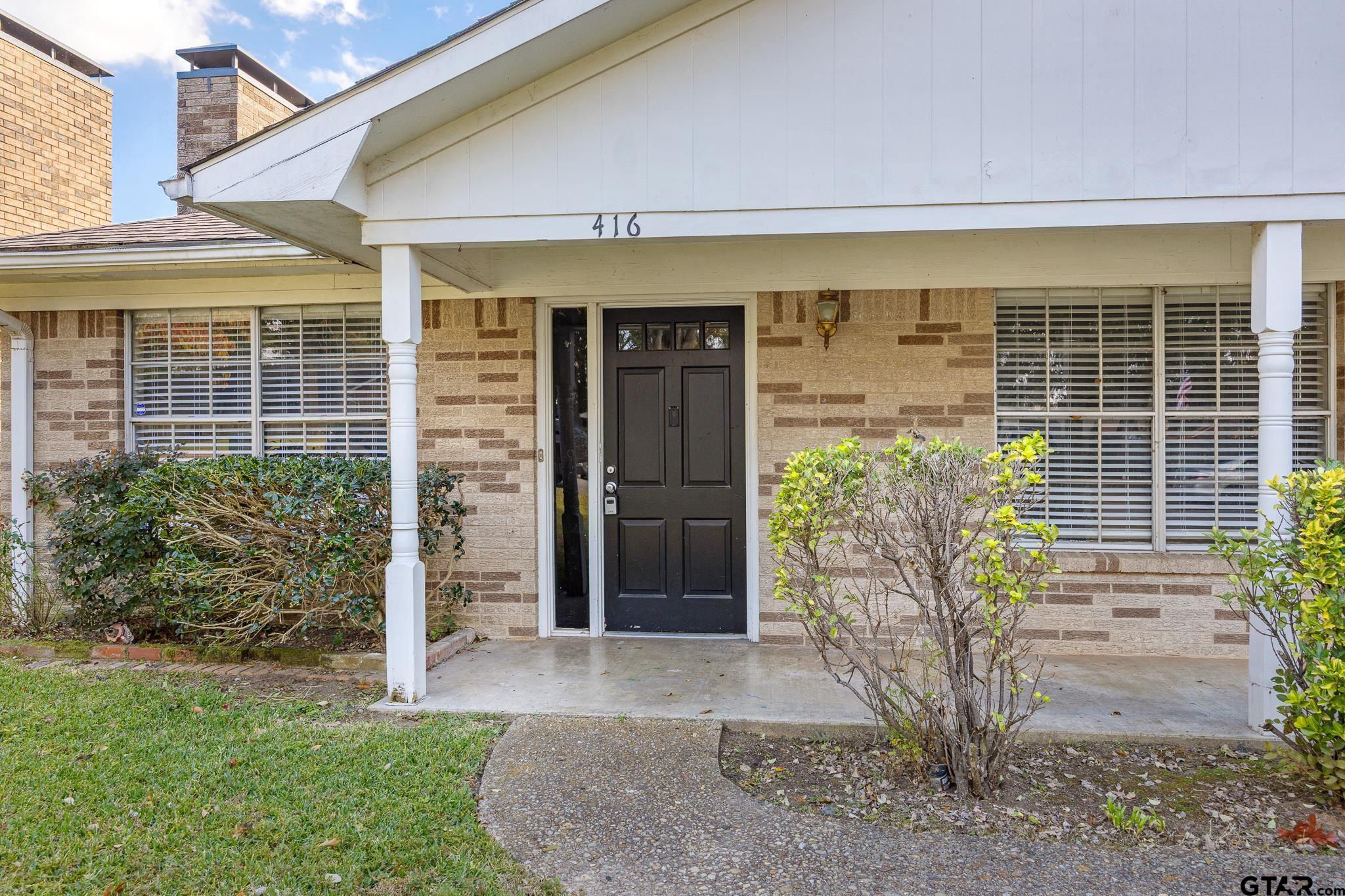 418 Boyd Lane Tyler, TX 75703 - Photo 3 of 25 a front view of a house with garden