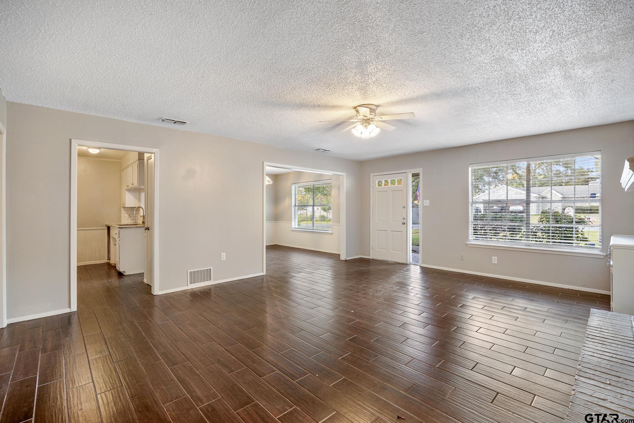 418 Boyd Lane Tyler, TX 75703 - Photo 6 of 25 wooden floor in an empty room with a window