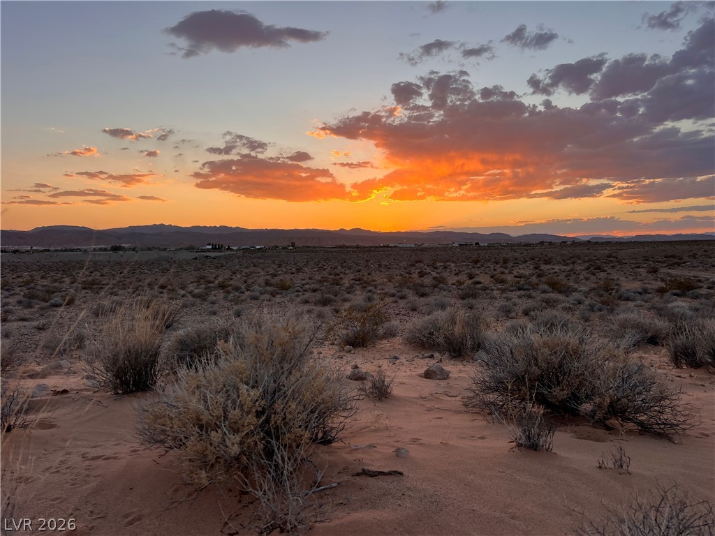 North Ishimoto Overton, NV 89040 - Photo 9 of 10 Witness glorious sunset hues over a vast, undeveloped landscape with distant mountains.