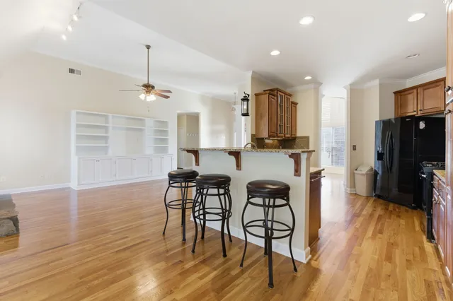 a view of a dining room with furniture and wooden floor