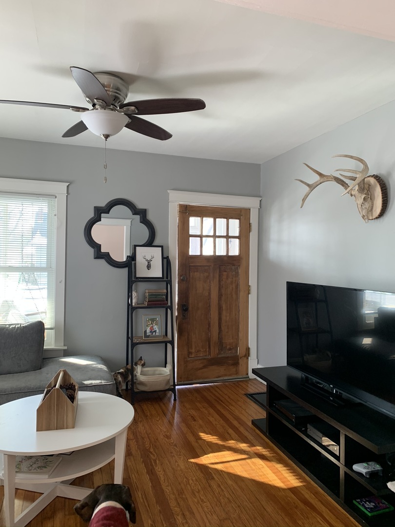 1908 Evergreen Road Homewood, IL 60430 - Photo 4 of 21 a living room with furniture a flat screen tv and a window