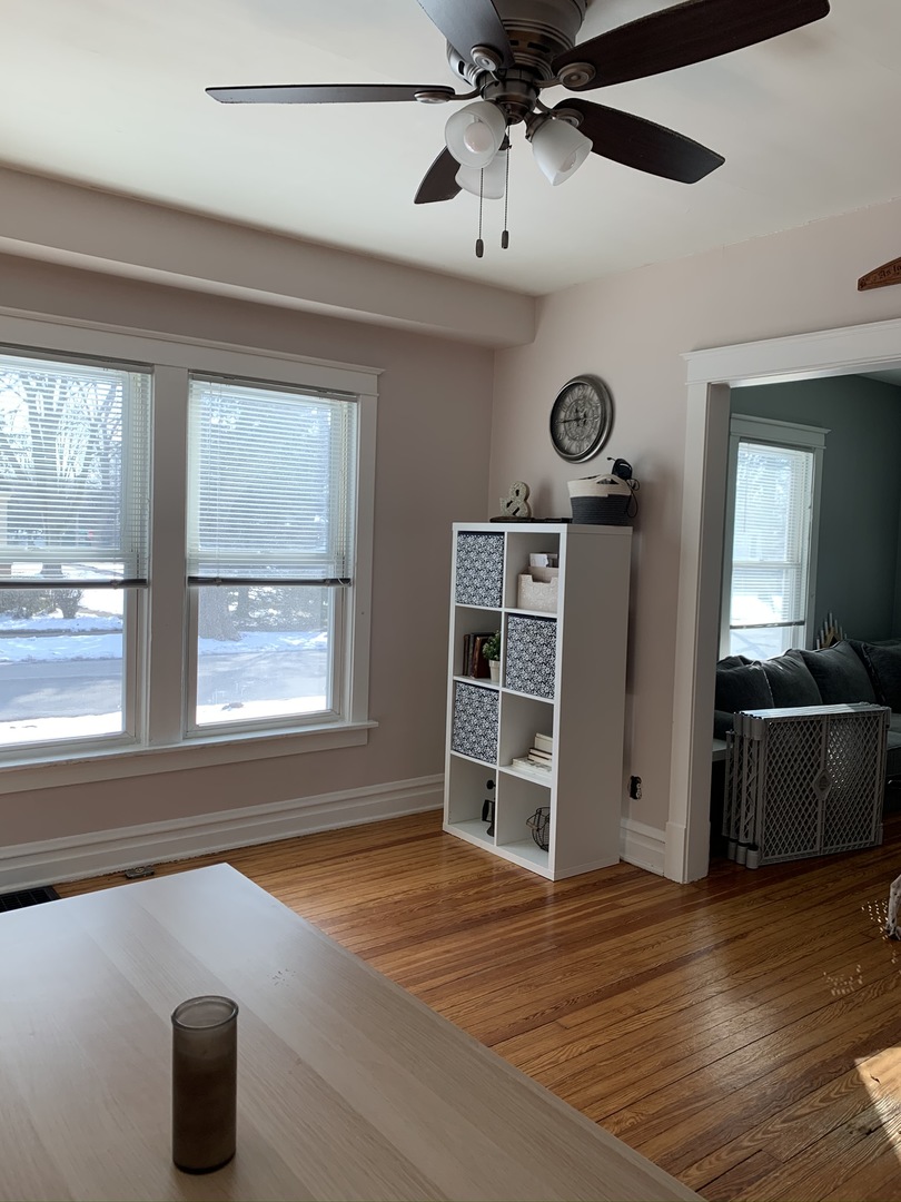 1908 Evergreen Road Homewood, IL 60430 - Photo 7 of 21 a view of an empty room with a window and wooden floor