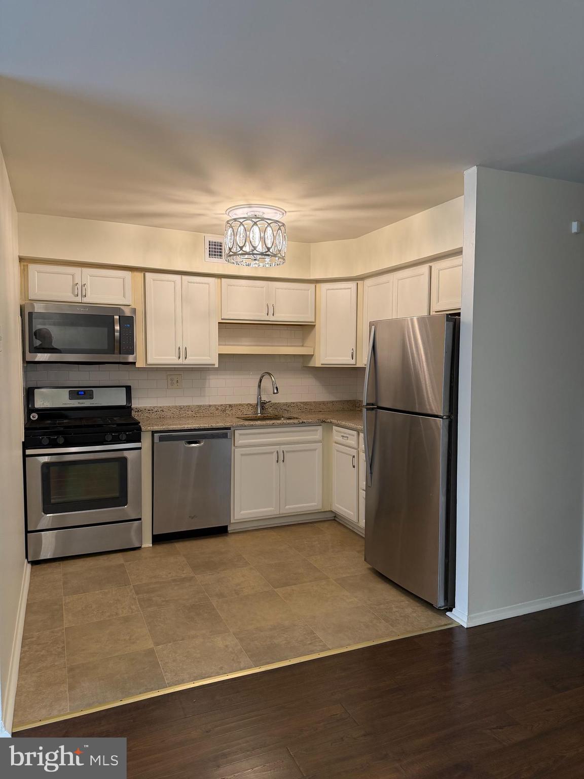 3766 Morrell Avenue Philadelphia, PA 19114 - Photo 5 of 14 a kitchen with a sink and white stainless steel appliances
