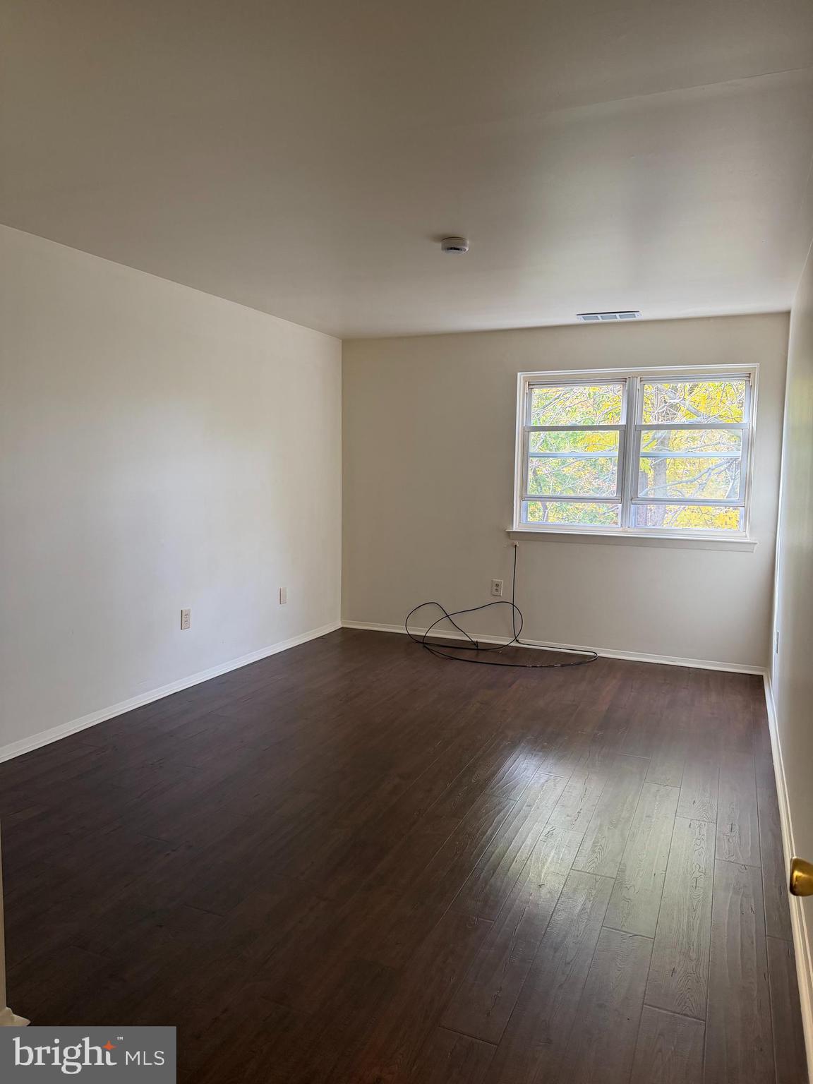 3766 Morrell Avenue Philadelphia, PA 19114 - Photo 7 of 14 an empty room with wooden floor and windows