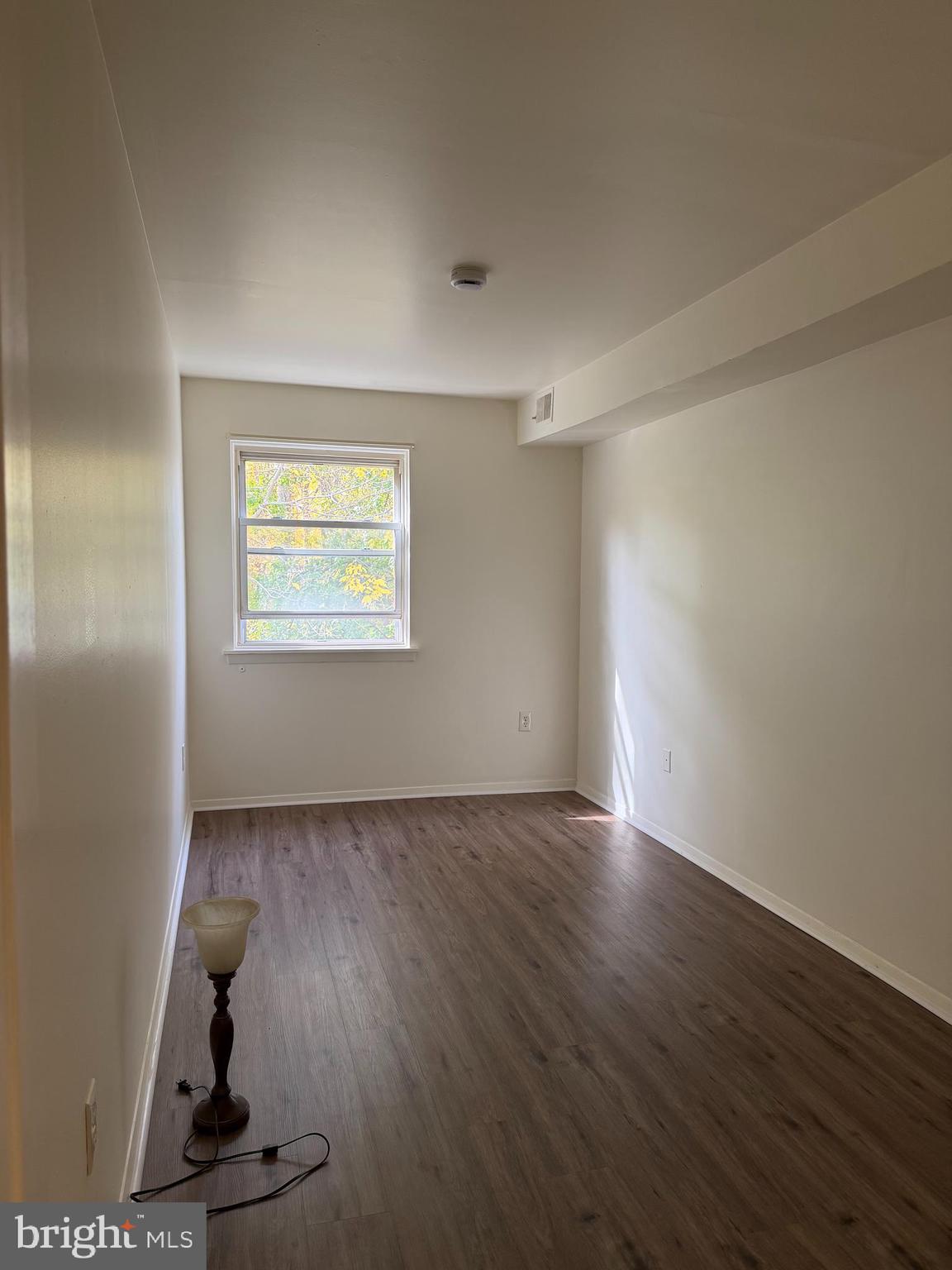 3766 Morrell Avenue Philadelphia, PA 19114 - Photo 8 of 14 an empty room with wooden floor and windows