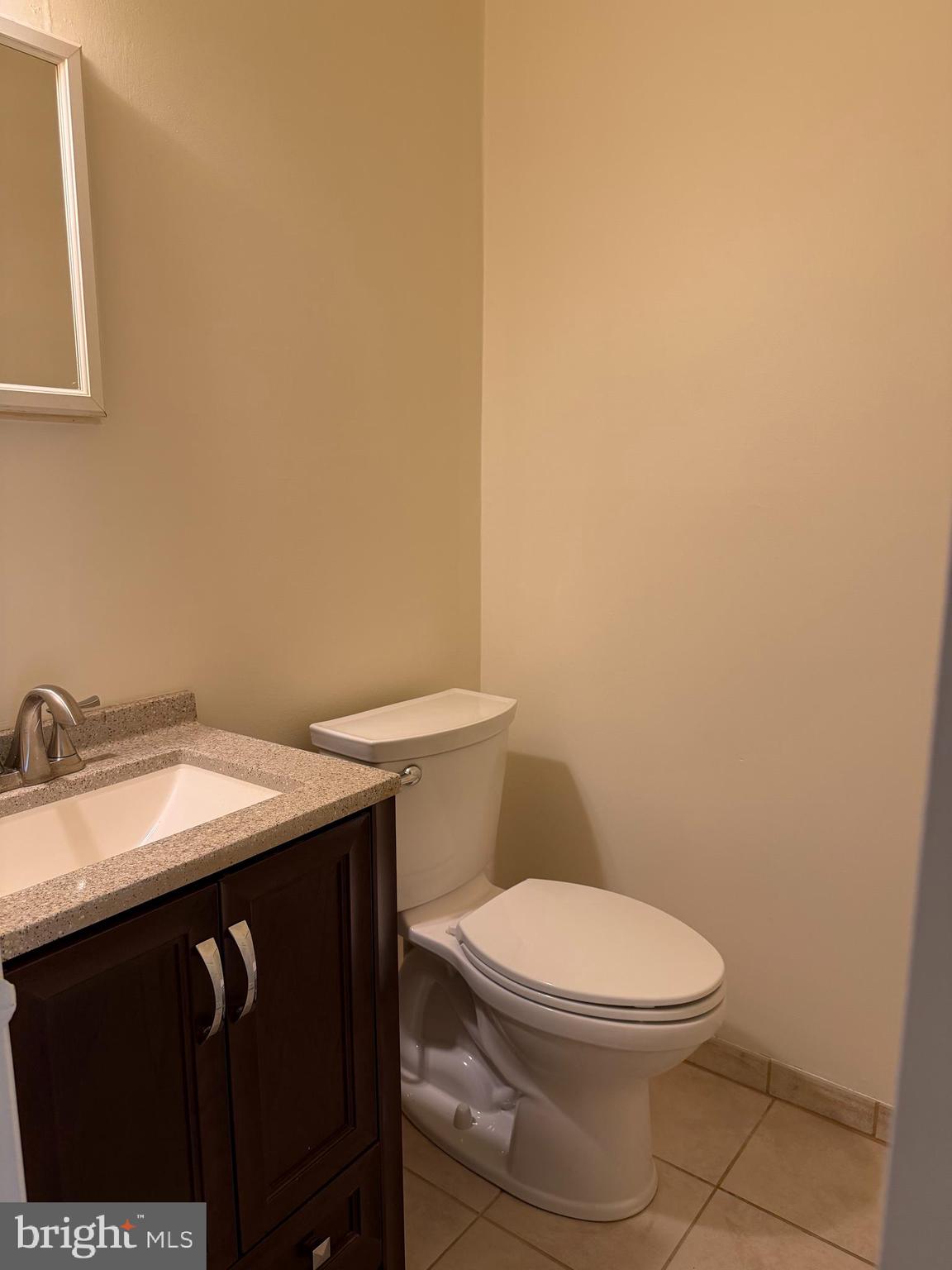 3766 Morrell Avenue Philadelphia, PA 19114 - Photo 10 of 14 a bathroom with a granite countertop toilet sink and mirror