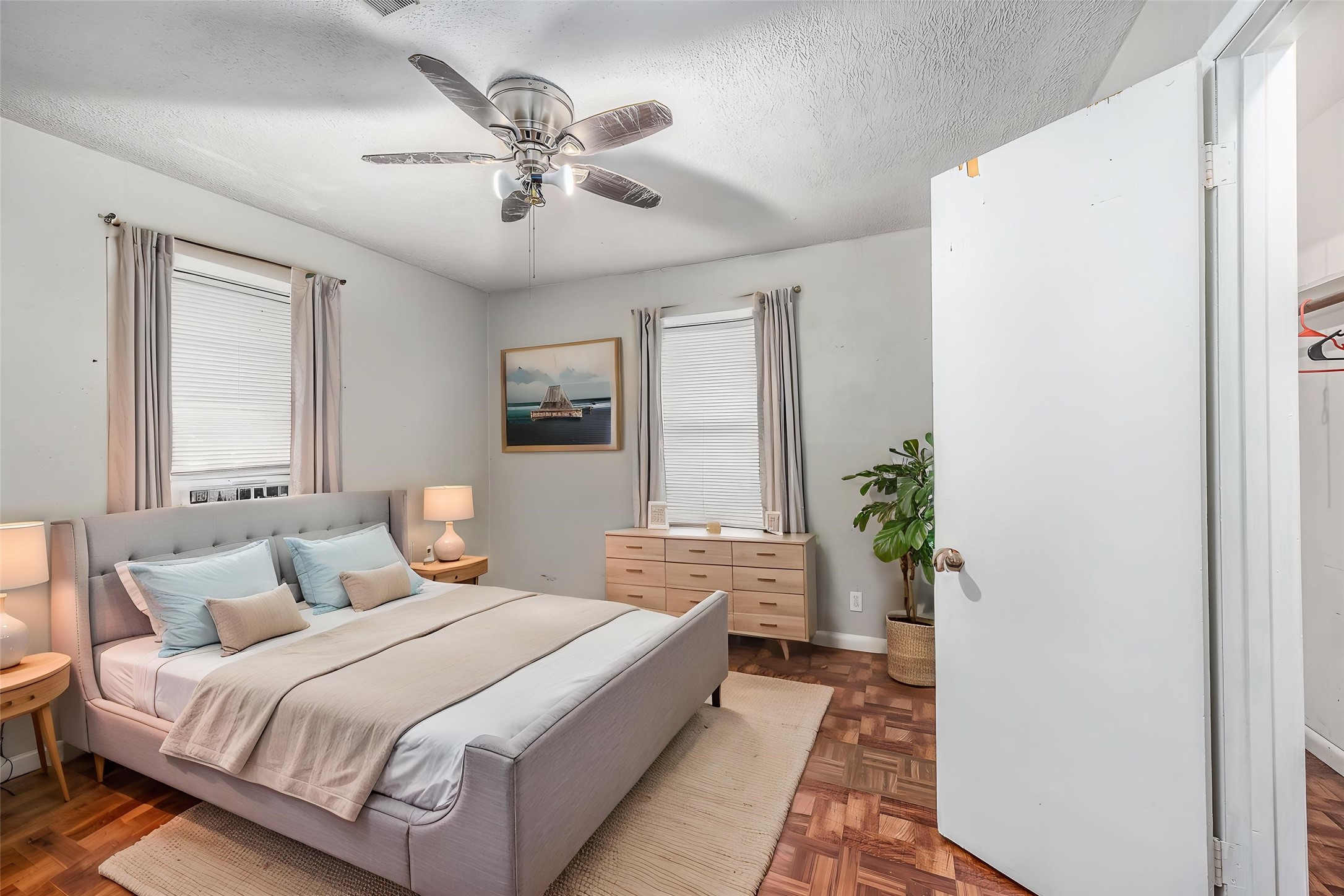502 Massey Tompkins Road Baytown, TX 77521 - Photo 19 of 32 a spacious bedroom with a bed and a chandelier