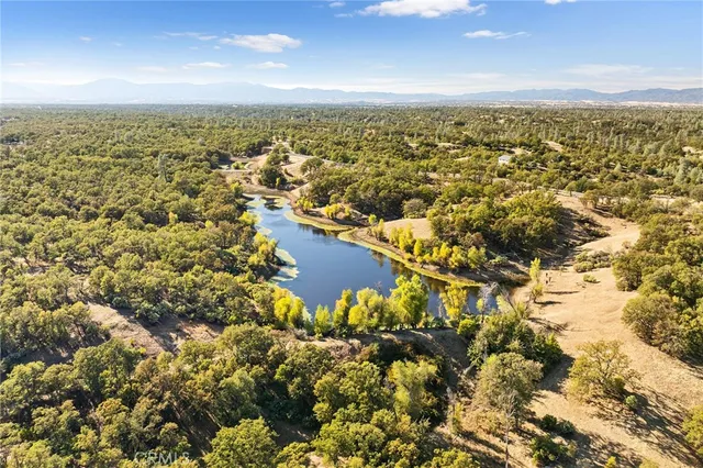 an aerial view of residential building and lake