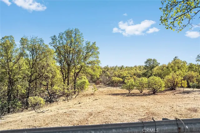 a view of a house with a yard patio and sitting area