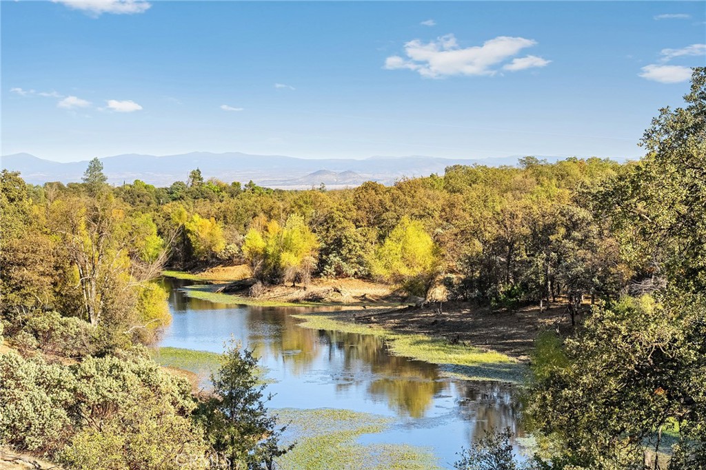 16925 Basler Road Cottonwood, CA 96022 - Photo 28 of 55 a view of a lake with a mountain in the background