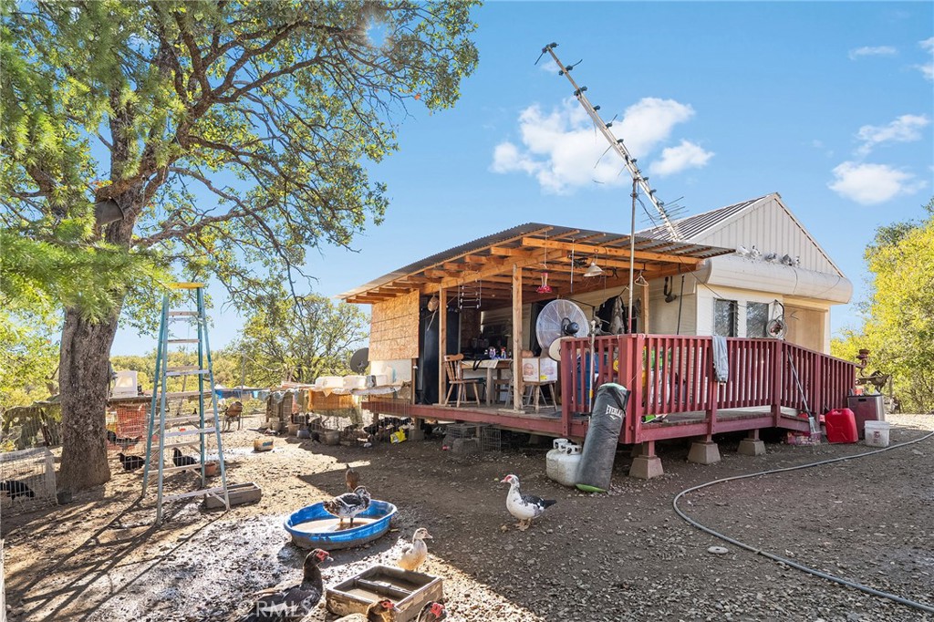 16925 Basler Road Cottonwood, CA 96022 - Photo 32 of 55 a view of a house with a yard patio and sitting area