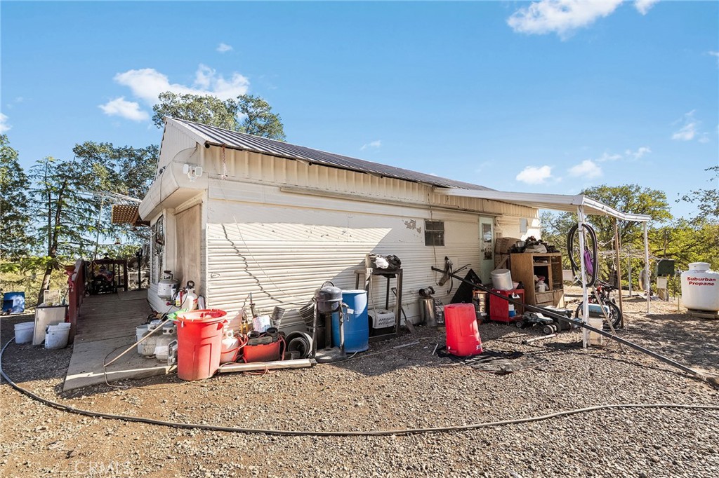 16925 Basler Road Cottonwood, CA 96022 - Photo 33 of 55 a view of a garage with a white table and chairs