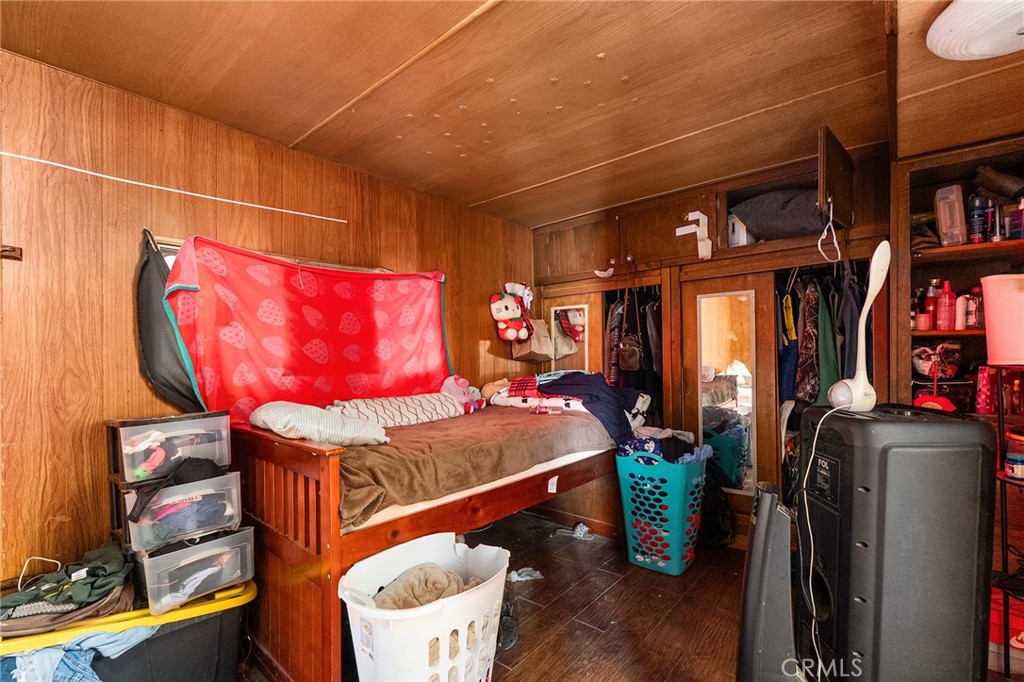 16925 Basler Road Cottonwood, CA 96022 - Photo 35 of 55 a room with bookshelf and wooden floor