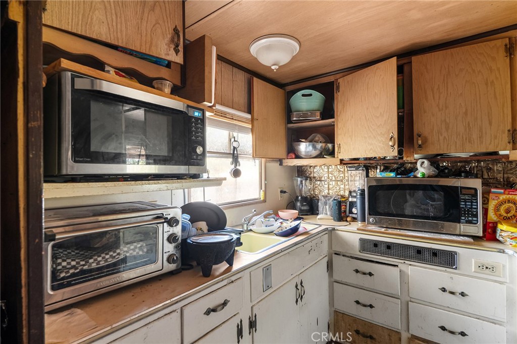 16925 Basler Road Cottonwood, CA 96022 - Photo 36 of 55 a kitchen with stainless steel appliances a stove and a microwave